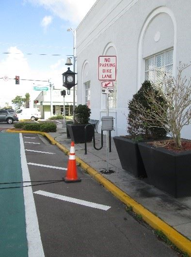 Photo of a traffic counting device alongside a road.